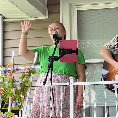 Sarah singing during a porch performance.